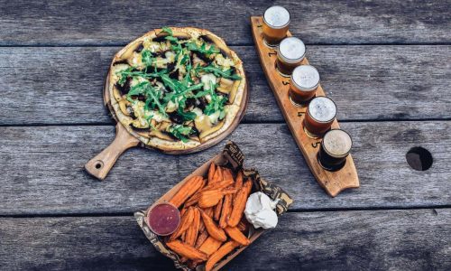 pizza and fries with lightest to darkest drink on the side