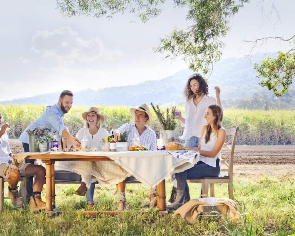 a group of people are enjoying their outdoor lunch with relaxing view